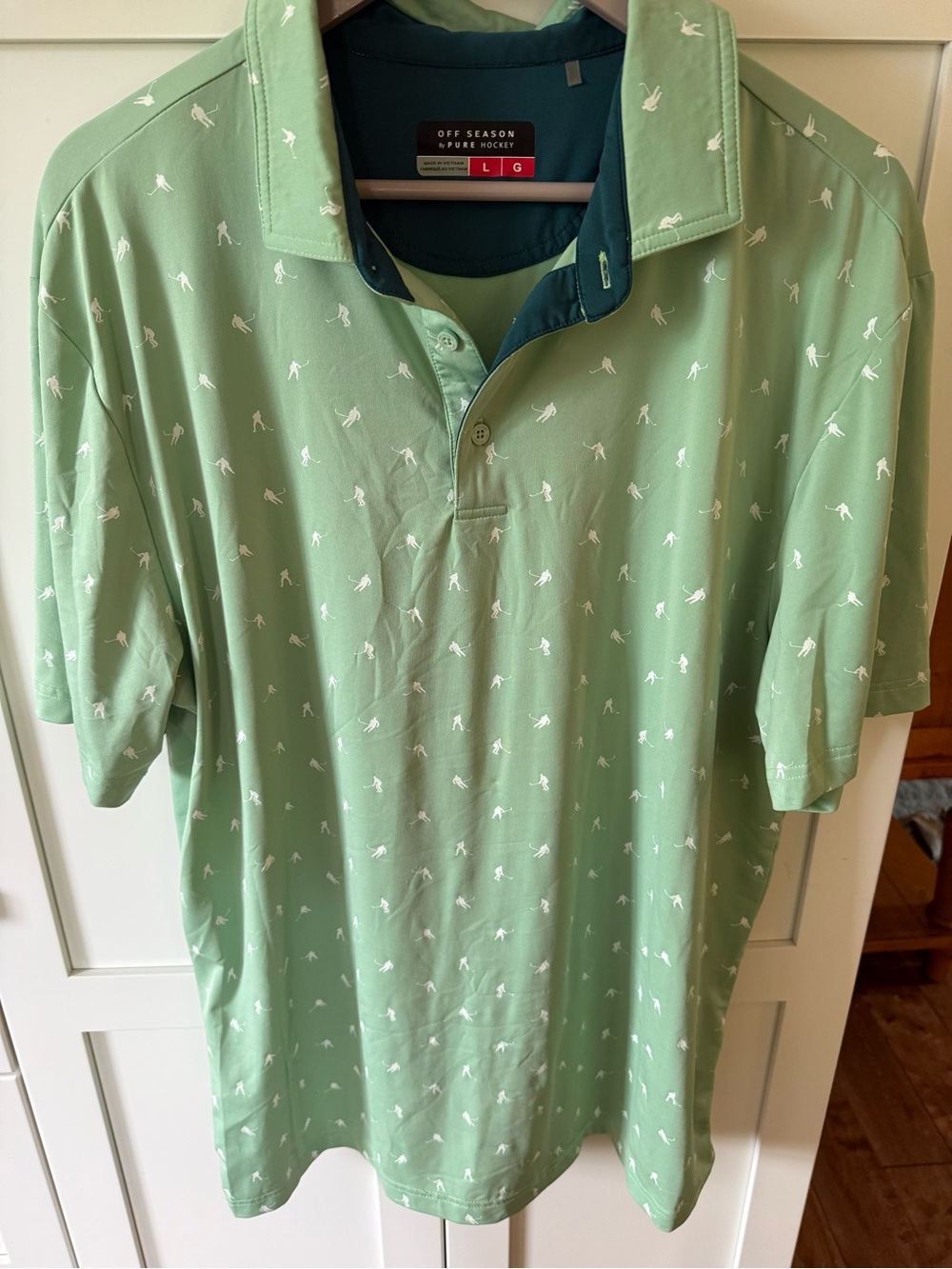 Off season by Pure Hockey, Men’s Light Sage Green with small hockey players.